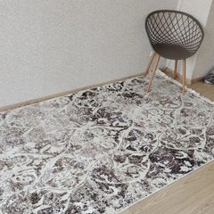 Турецький килим у спальню з китицями
